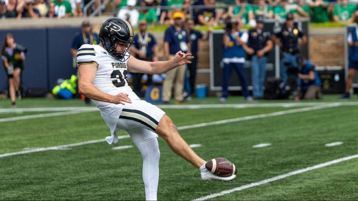 Jack McCallister punting for Purdue