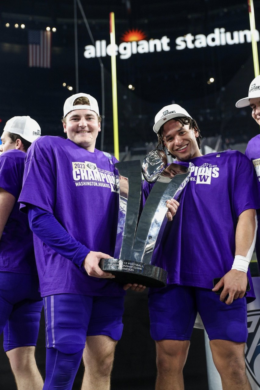 Jack McCallister holding the 2023 Pac-12 Championship trophy